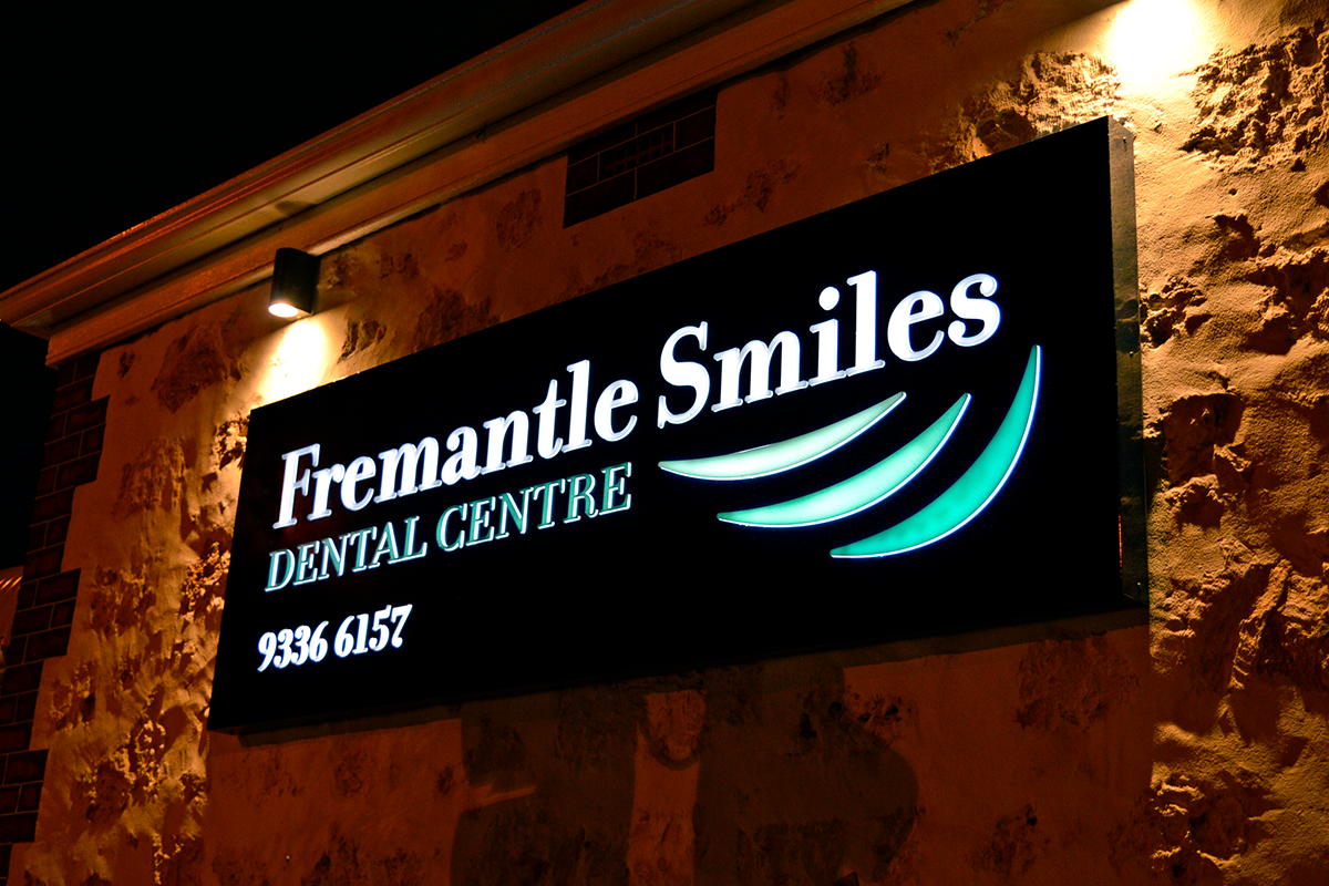 Illuminated lightbox sign dental centre Perth Commercial Signage 25 Fremantle Smiles illuminated lightbox sign on side of Perth dental centre building