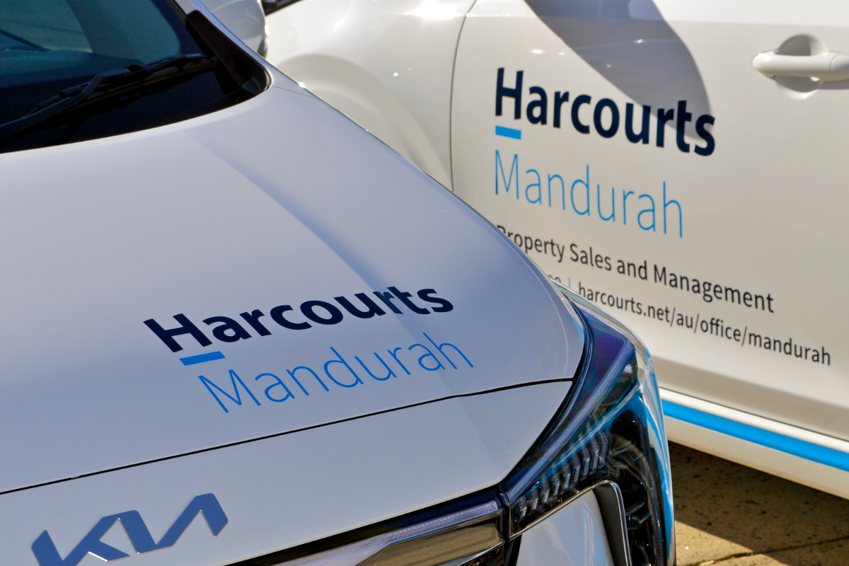 Harcourts Perth vehicle signage Fleet Graphics 10 Harcourts mandurah fleet graphics on KIA sedans