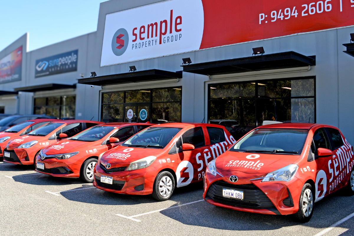 Semple Fleet Vehicle Signage Vehicle Graphics 2 Line up of Semple Property Group vehicles displaying car wrap signage outside Perth business permise