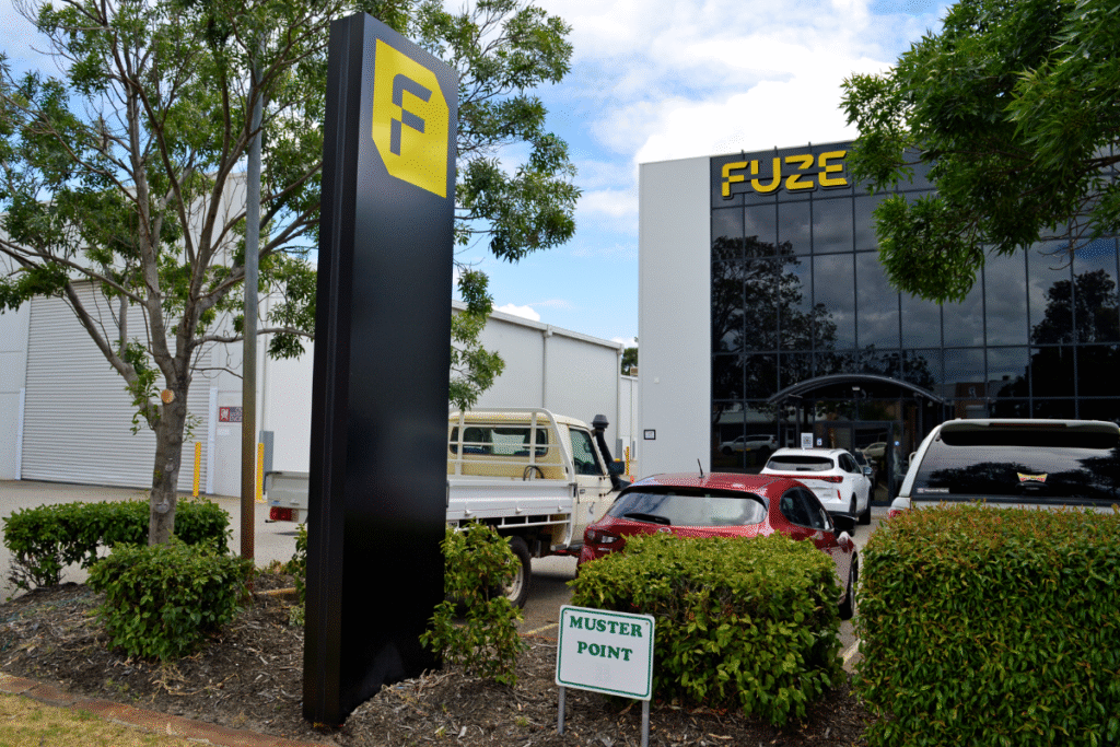 exterior building signage pylon perth FUZE - Relocation Signage Strategy 4 building sign on exterior of building with pylon sign