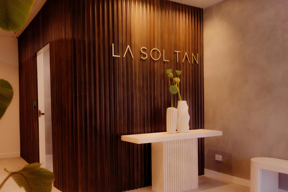 La Sol Tan Reception Signage Perth Go Graphics Reception Signage 14 La Sol Tan front entrance reception sign on wood panelled wall