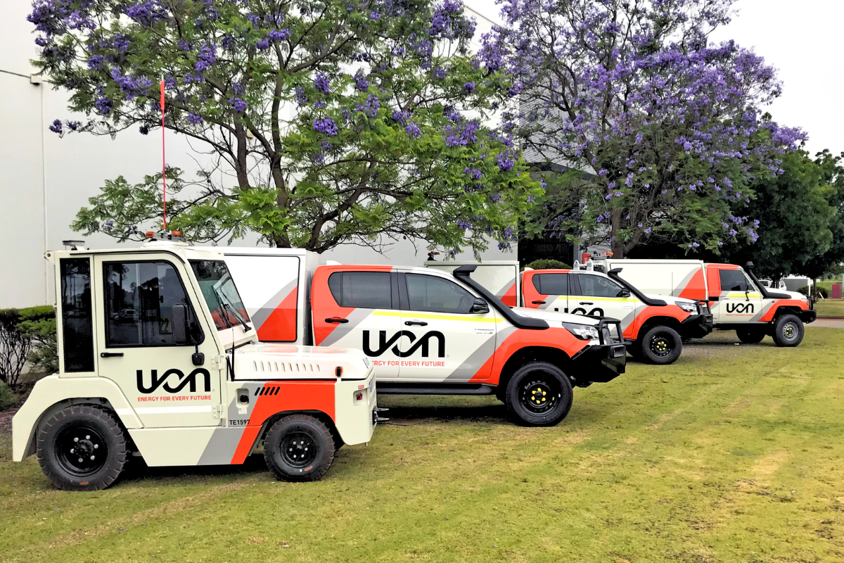 Mine spec Signage Perth UON Vehicle Graphics 77 UON fleet of different vehicles and machinery lined up outside Perth office displaying vibrant vehicle signage and mine spec graphics