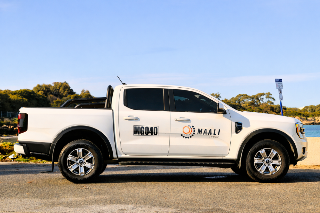 Go Graphics Vehicle Signage Maali VEHICLE SIGNAGE: YOUR QUESTIONS ANSWERED 9 Maali ute with spot graphics and mine spec signage parked near Perth coast