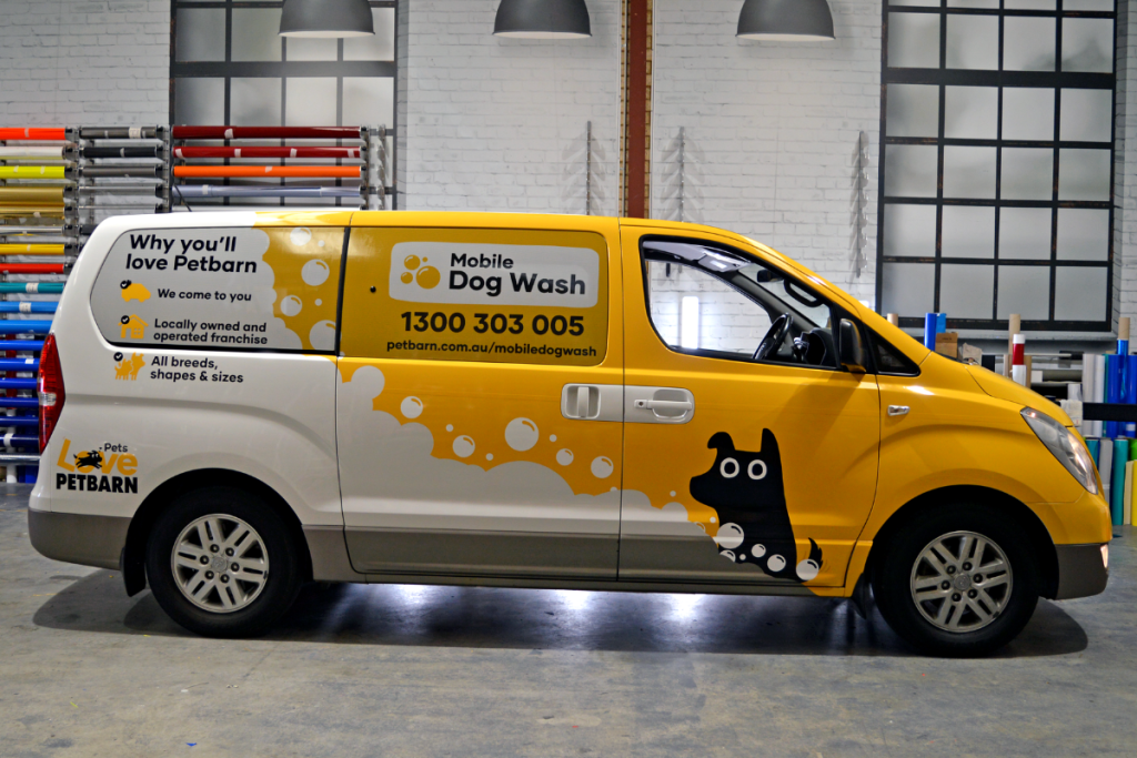 Vehicle Signage Go Graphics Petbarn VEHICLE SIGNAGE: YOUR QUESTIONS ANSWERED 3 Van parked inside Go Graphics workshop dispplaying vibrant Petbarn branding as ute partial wrap graphics